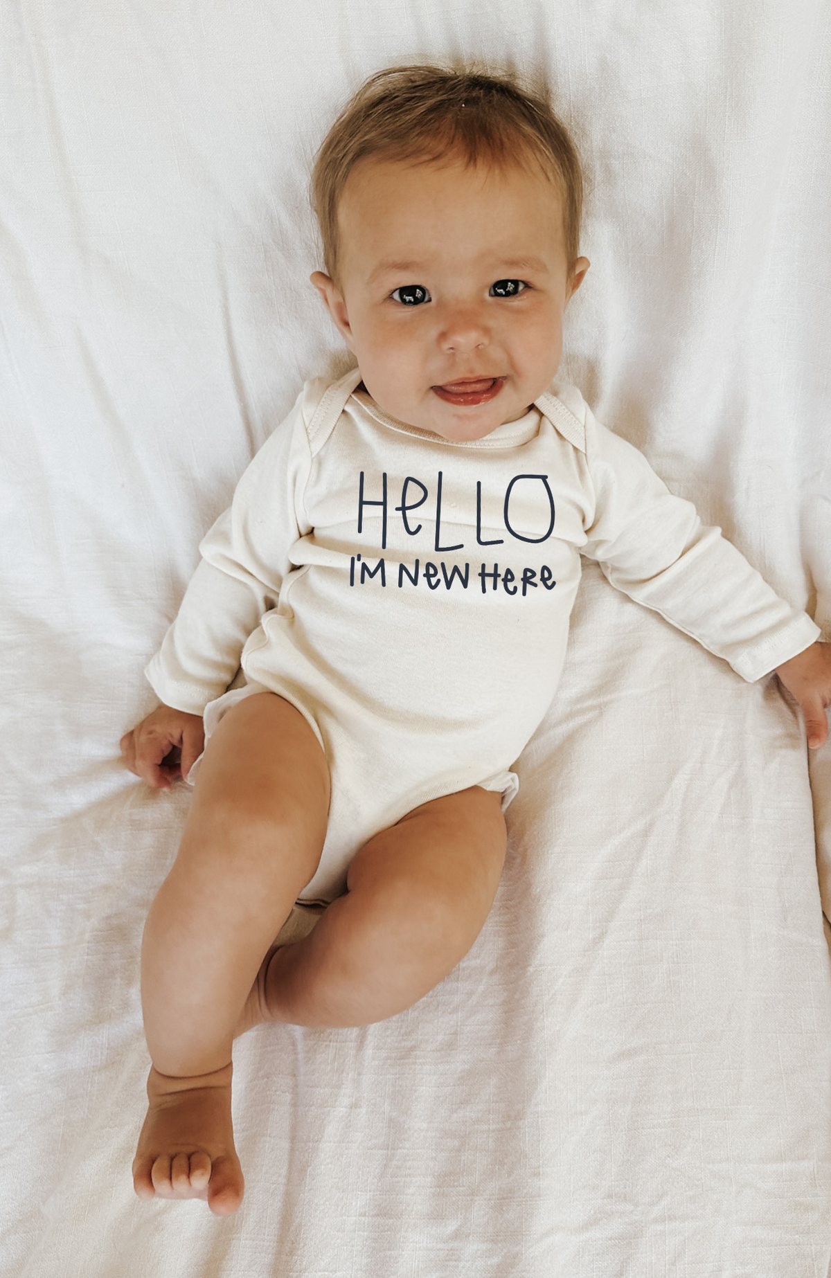"Hello, I'm New Here" Organic Baby Bodysuit