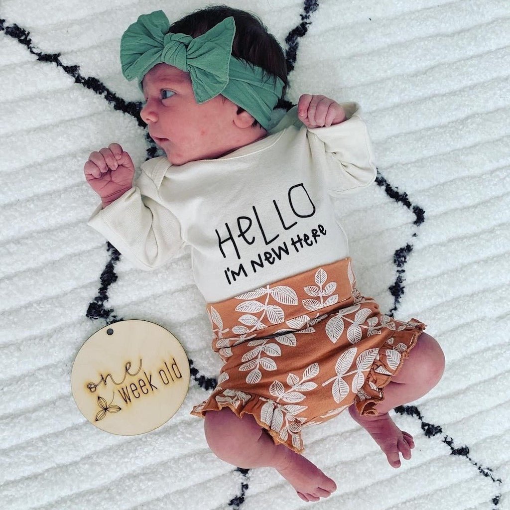"Hello, I'm New Here" Organic Baby Bodysuit
