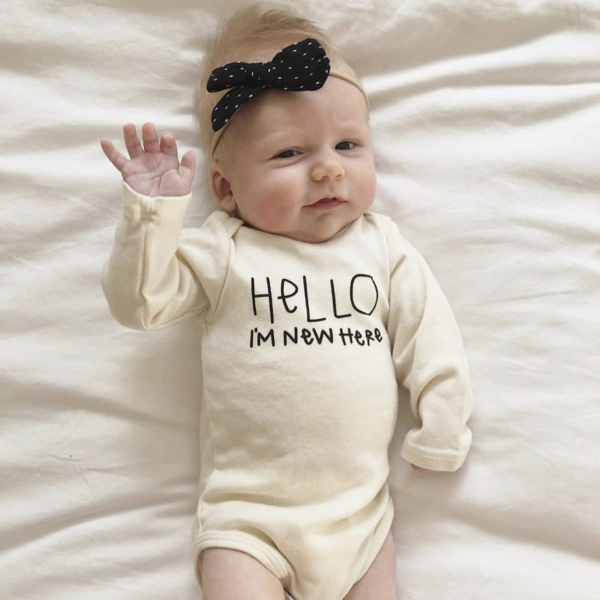 "Hello, I'm New Here" Organic Baby Bodysuit